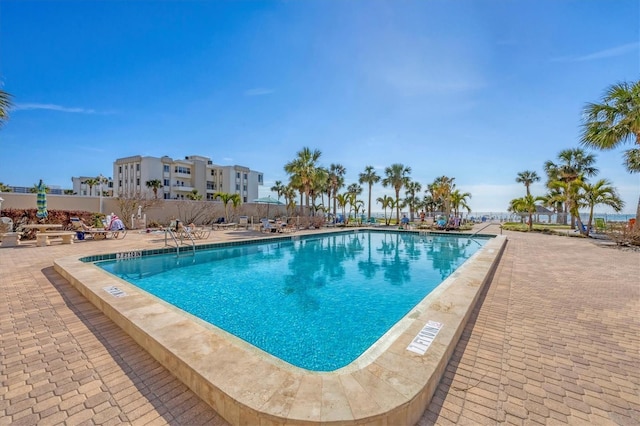 view of swimming pool featuring a patio