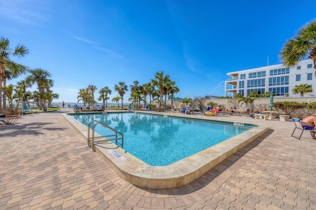 view of swimming pool featuring a patio area