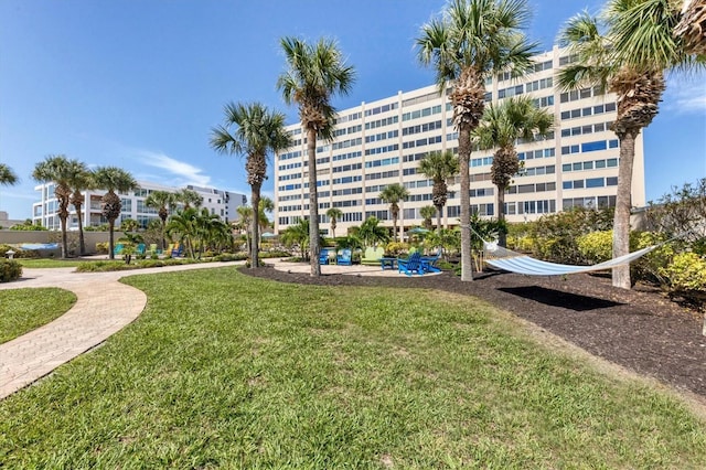 view of home's community featuring a lawn