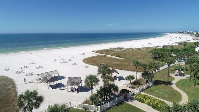 bird's eye view featuring a water view and a beach view