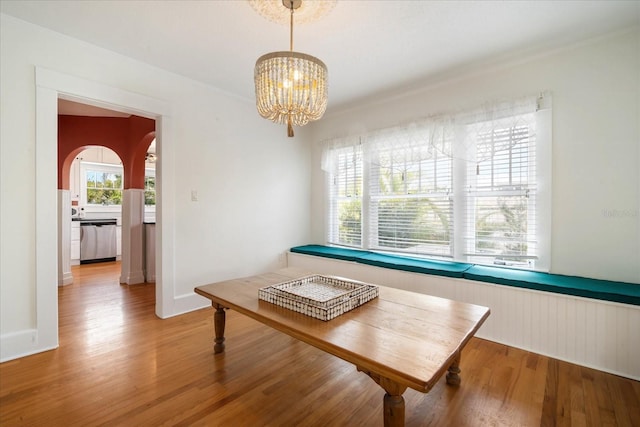 dining room with wood-type flooring and a chandelier