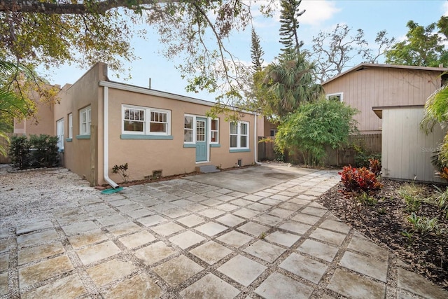 back of property featuring a patio