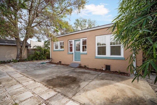 rear view of house with a patio