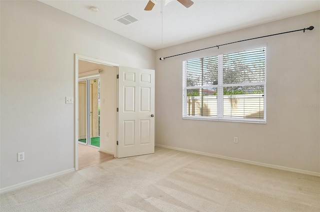 unfurnished bedroom with baseboards, visible vents, and light colored carpet