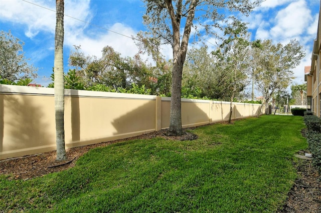 view of yard with a fenced backyard