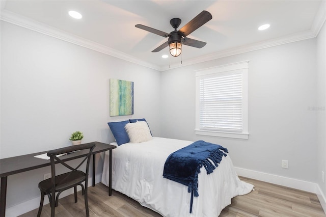 bedroom with crown molding, ceiling fan, and hardwood / wood-style floors