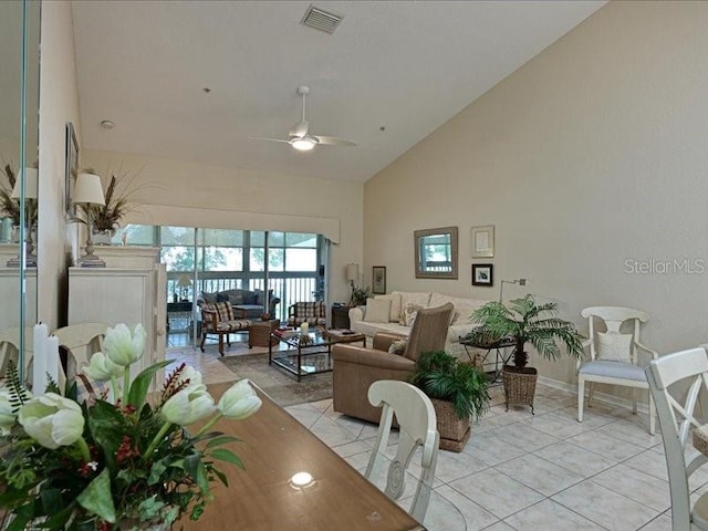 living room featuring high vaulted ceiling, light tile patterned floors, and ceiling fan