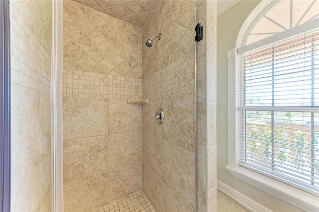 bathroom with a tile shower