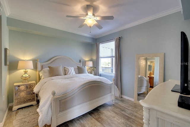 bedroom with crown molding, ceiling fan, and light hardwood / wood-style flooring