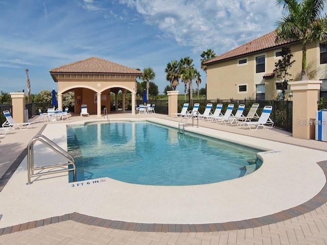 view of swimming pool featuring a patio