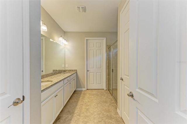 bathroom with vanity and walk in shower