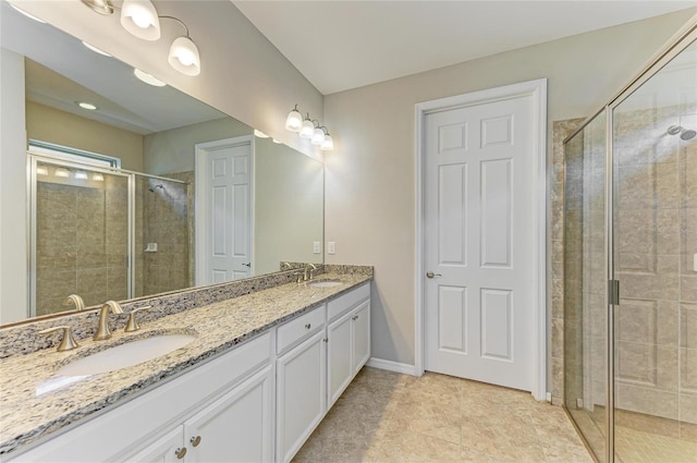 bathroom with vanity, tile patterned floors, and walk in shower