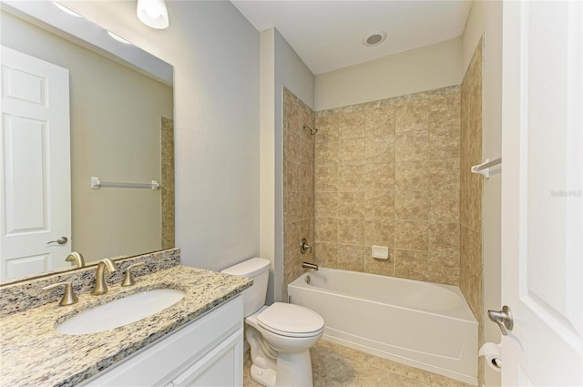 full bathroom featuring tile patterned floors, vanity, toilet, and tiled shower / bath combo