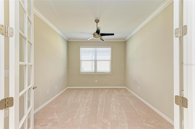 unfurnished room featuring french doors, light colored carpet, ornamental molding, and ceiling fan