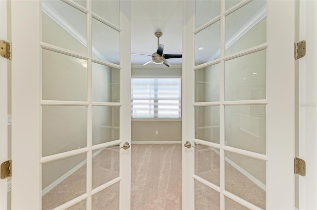 interior space with carpet, ceiling fan, and french doors