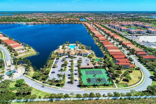 birds eye view of property featuring a water view