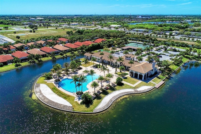 birds eye view of property with a water view