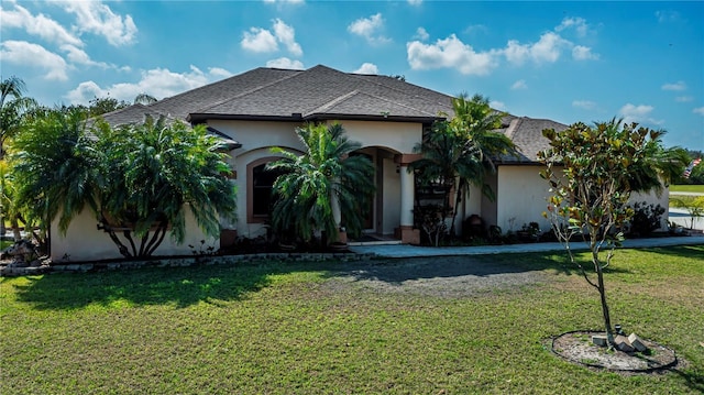 view of front of home with a front lawn