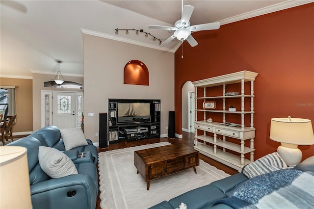 living room with ceiling fan, ornamental molding, rail lighting, and wood-type flooring