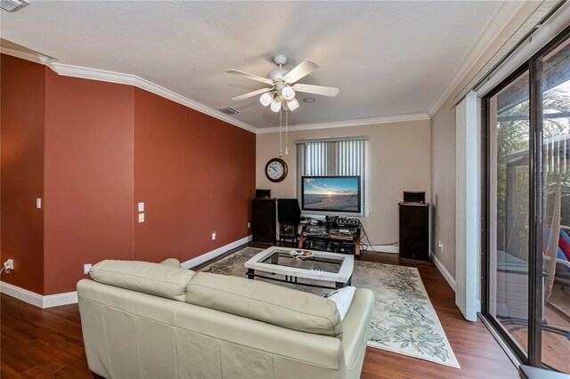 living room with crown molding, hardwood / wood-style flooring, and ceiling fan