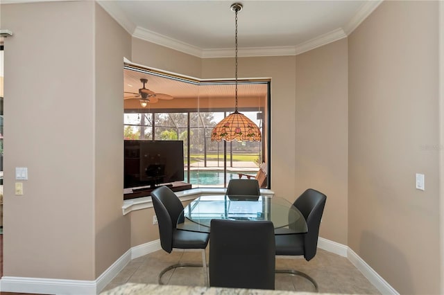 tiled dining room featuring ornamental molding