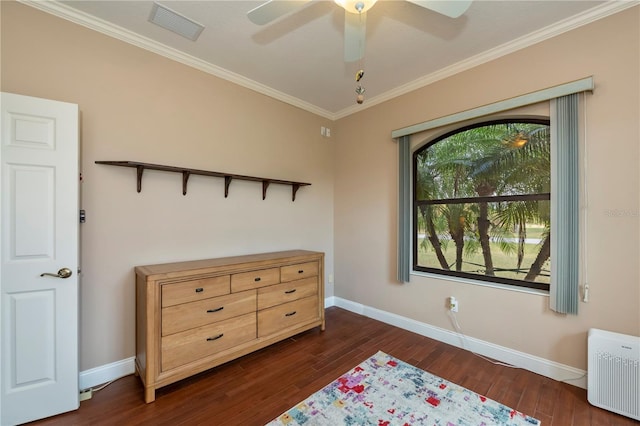 bedroom with dark wood-type flooring, ceiling fan, radiator heating unit, and crown molding