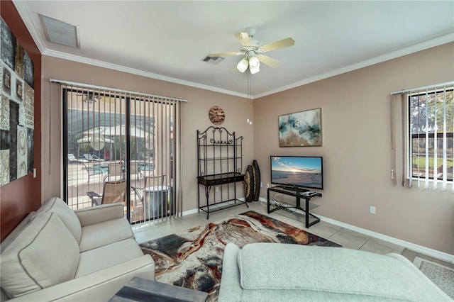 living room featuring light tile patterned flooring, ceiling fan, and crown molding