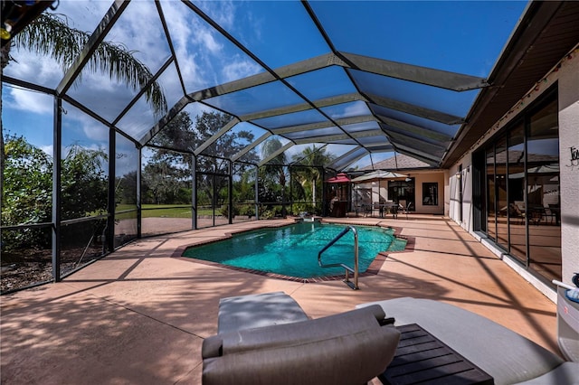 view of swimming pool with a patio area and glass enclosure