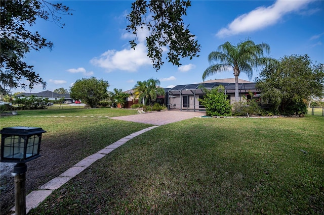 view of yard with a lanai