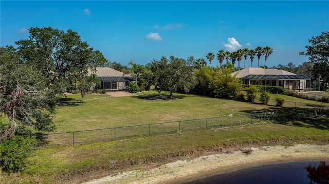 view of yard with a rural view and a lanai