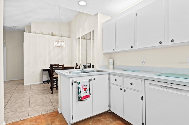 kitchen with white dishwasher, hanging light fixtures, tile patterned flooring, and white cabinets