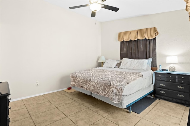 tiled bedroom with ceiling fan