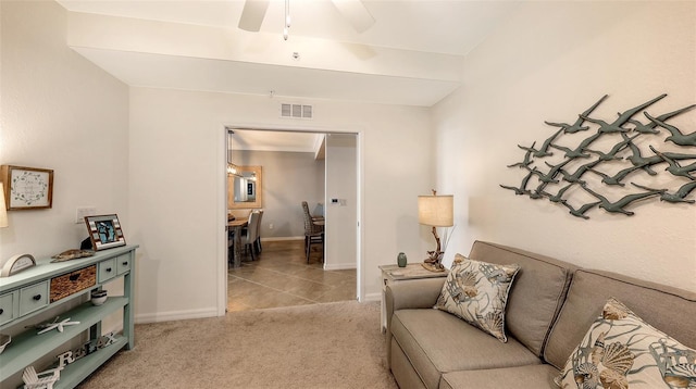 living room with light carpet and ceiling fan