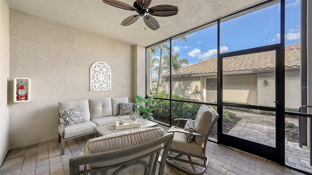 sunroom with ceiling fan