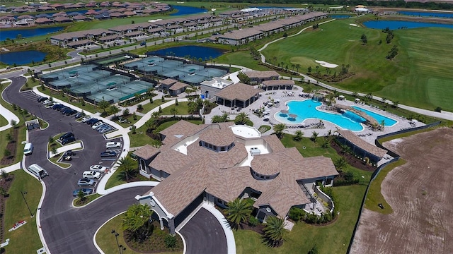 birds eye view of property with a water view