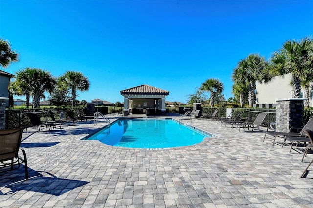 view of swimming pool featuring a patio area