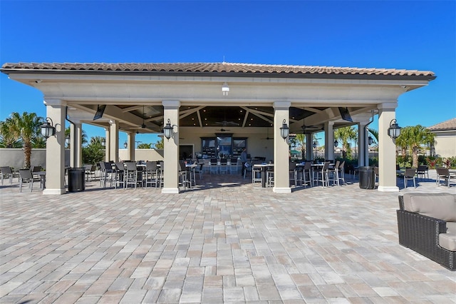 view of patio featuring ceiling fan