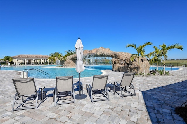 view of swimming pool featuring pool water feature