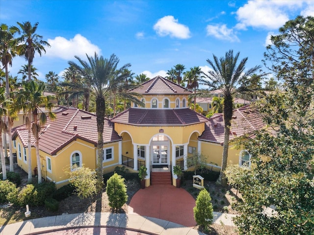 mediterranean / spanish-style home featuring french doors