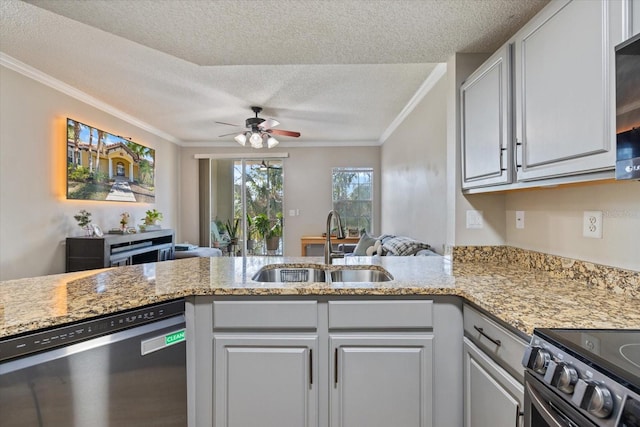 kitchen with sink, white cabinetry, ornamental molding, kitchen peninsula, and stainless steel appliances