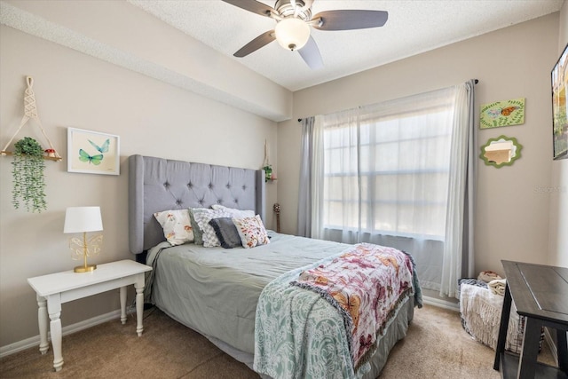 bedroom featuring light colored carpet and ceiling fan