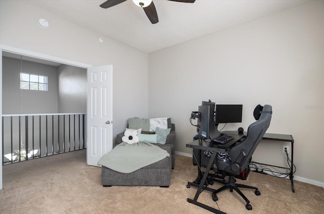 home office featuring vaulted ceiling and light carpet