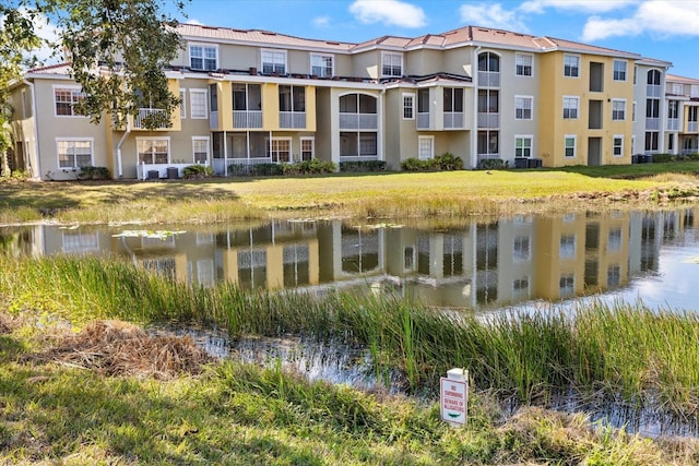 view of building exterior with a water view