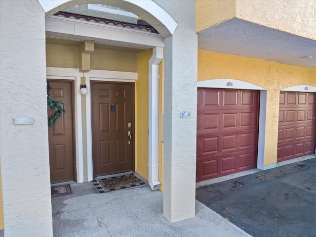 entrance to property featuring a garage