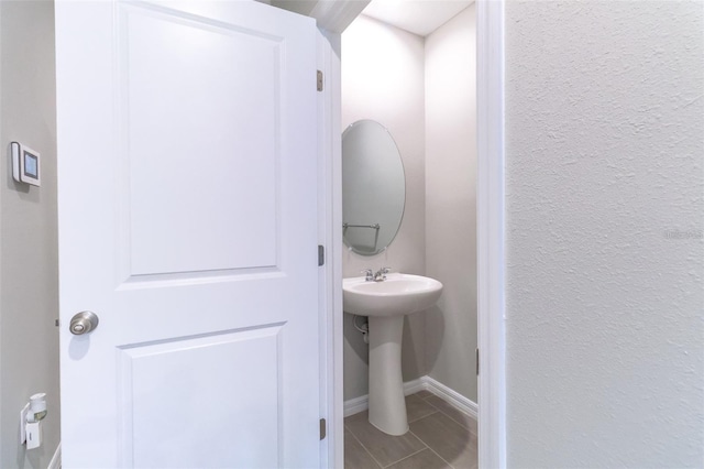 bathroom with tile patterned flooring