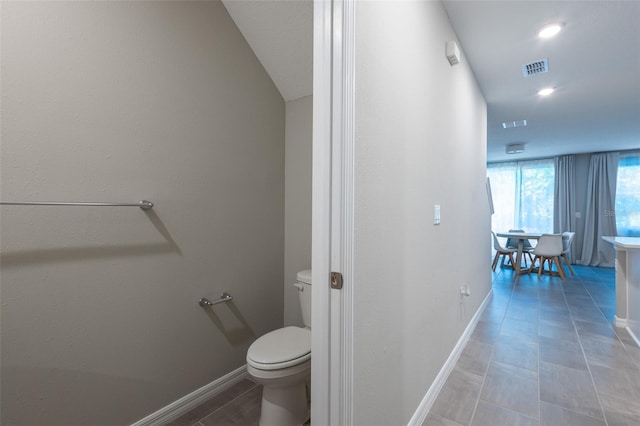 17136 Blowfish Dr, Nokomis, FL 34275 - bathroom with toilet and baseboards