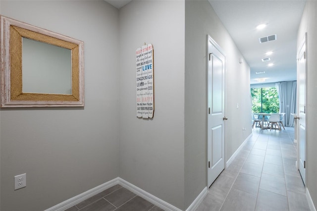 17136 Blowfish Dr, Nokomis, FL 34275 - corridor featuring tile patterned flooring and recessed lighting