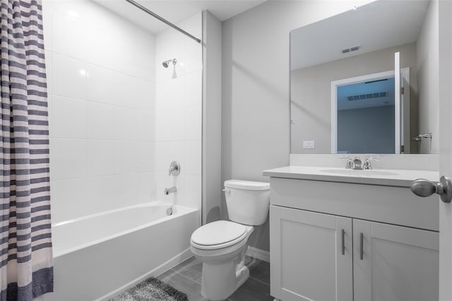 17136 Blowfish Dr, Nokomis, FL 34275 - bathroom featuring shower / bath combo with shower curtain, vanity, and tile patterned flooring
