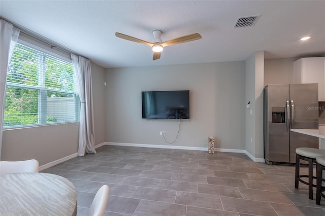 17136 Blowfish Dr, Nokomis, FL 34275 - living room featuring ceiling fan and baseboards