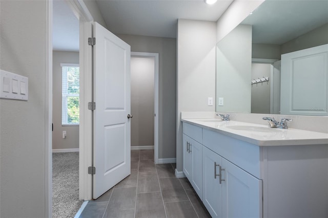 17136 Blowfish Dr, Nokomis, FL 34275 - full bathroom featuring double vanity and baseboards